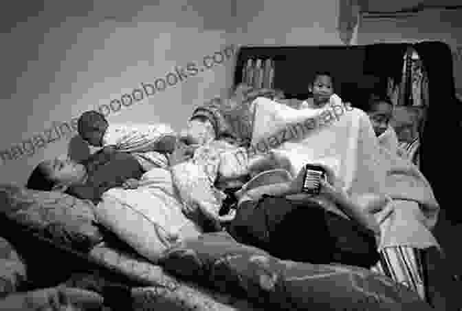 A Black And White Photograph Of A Family Huddled Together In A Makeshift Shelter. North For The Harvest: Mexican Workers Growers And The Sugar Beet Industry