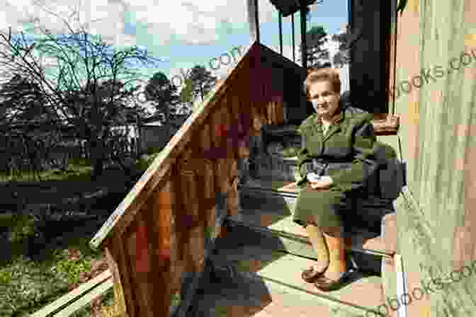 An Elderly Woman Sits On A Porch Swing In A Remote Appalachian Village. Bygone Backwoods Lisa Cooper