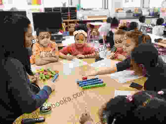 Image Of A Teacher Working With A Small Group Of Students In A Classroom. The Self Organizing Revolution: Common Principles Of The Educational Alternatives Movement